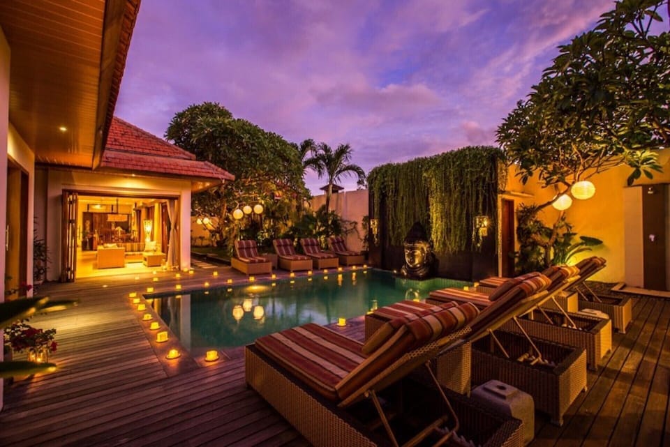 Private pool area with beautiful night lighting
