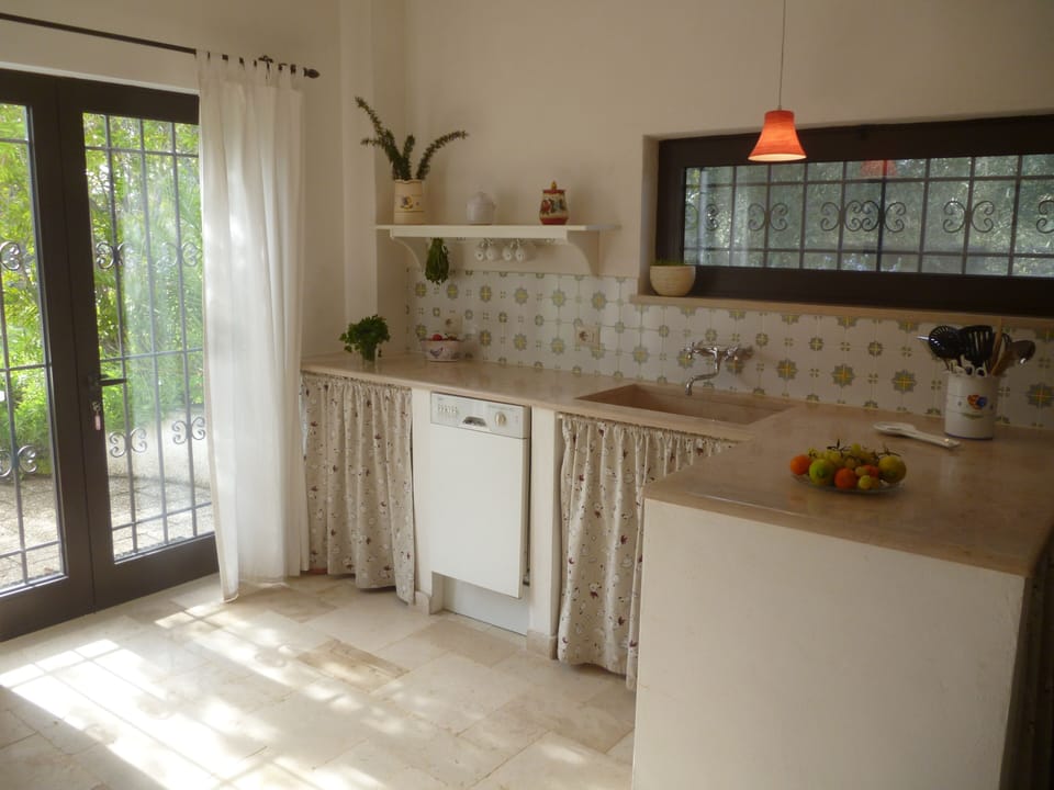 Kitchen with doors leading out to terrace