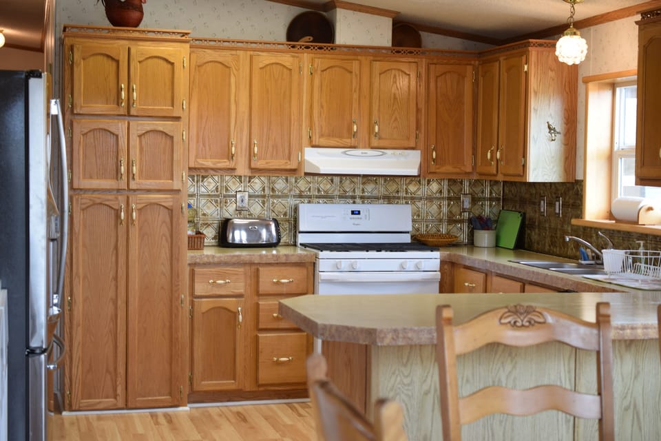  Kitchen stocked with everything you need to cook with including basic staples. 