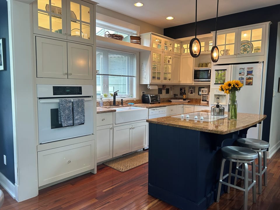 Fully stocked, modern, sunny kitchen/great room/living/dining room with island