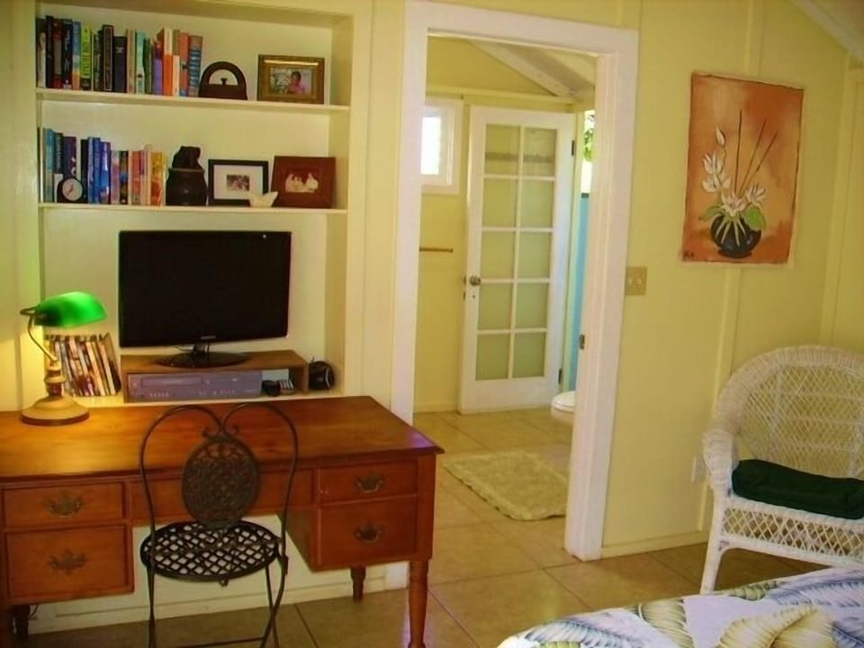 This cabin has a bedroom, bathroom, kitchenette and porch.