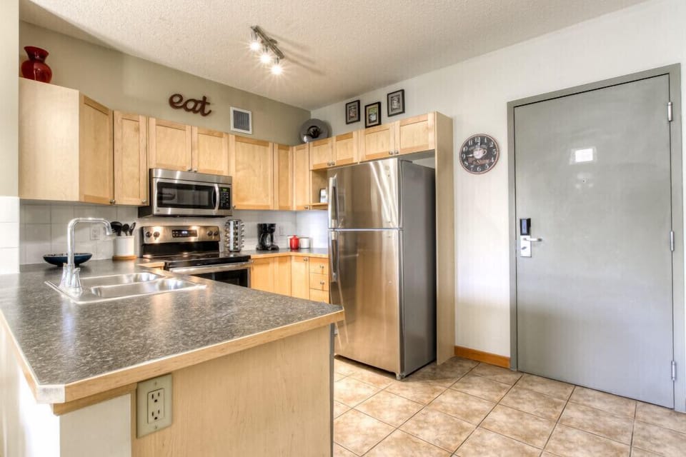 Fully Stocked Kitchen w/ Stainless Appliances. 