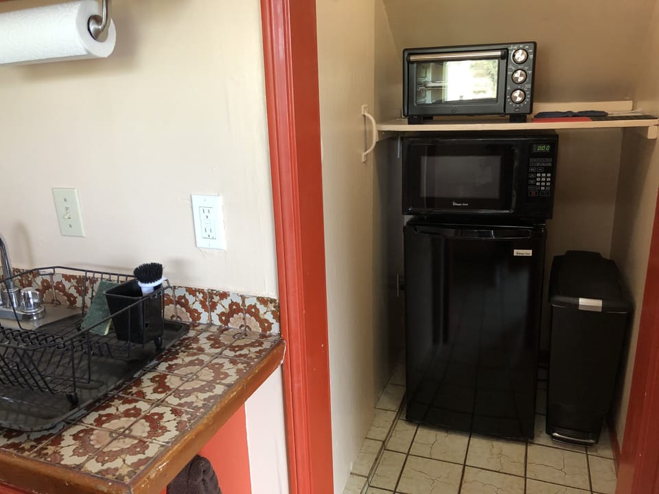Kitchenette with microwave toaster oven, fridge, etc
