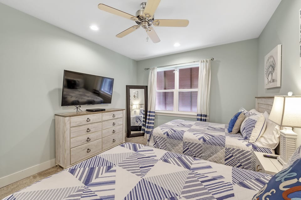 Dresser with large tv; floor mirror