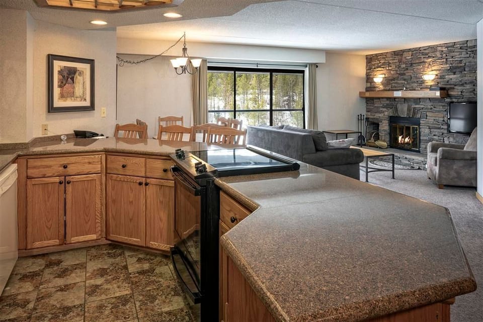 Prepare meals in the fully-equipped kitchen overlooking the living room.