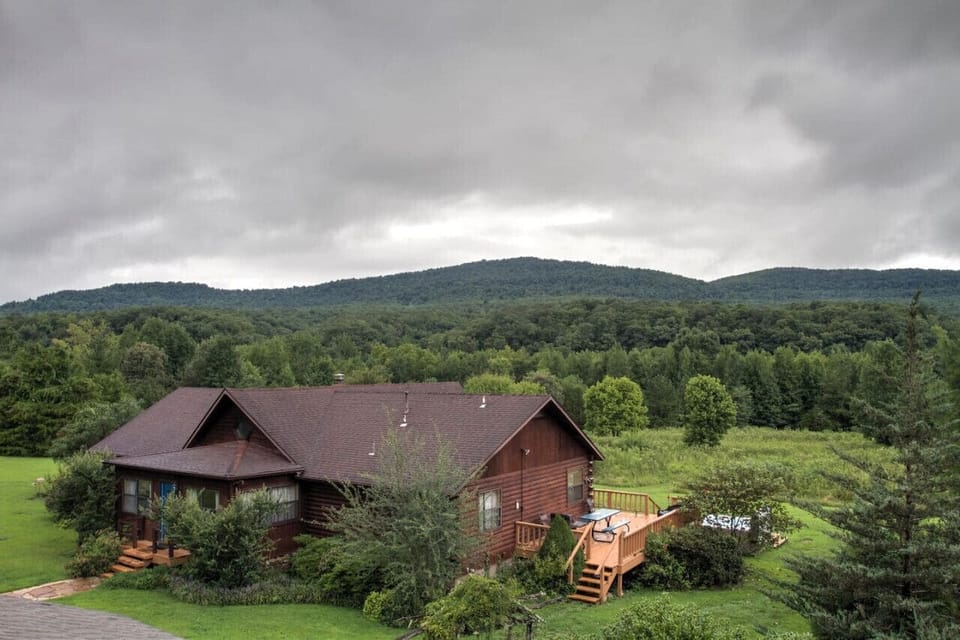 Our beautiful mountain view. The 3 acre landscaped yard is a perfect for kids.  We provide horse shoes, croquet, and yard games.