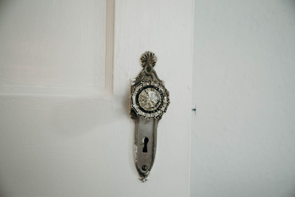 Original glass knobs throughout the house.
