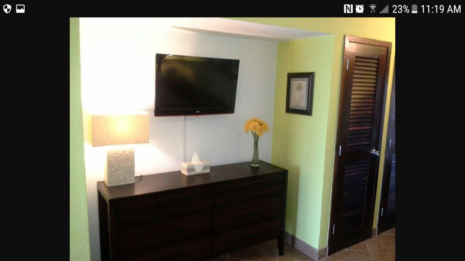 Flat screen TV in the bedroom area