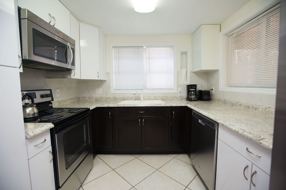 Past your dining area is the kitchen. Includes built in microwave, dishwasher.