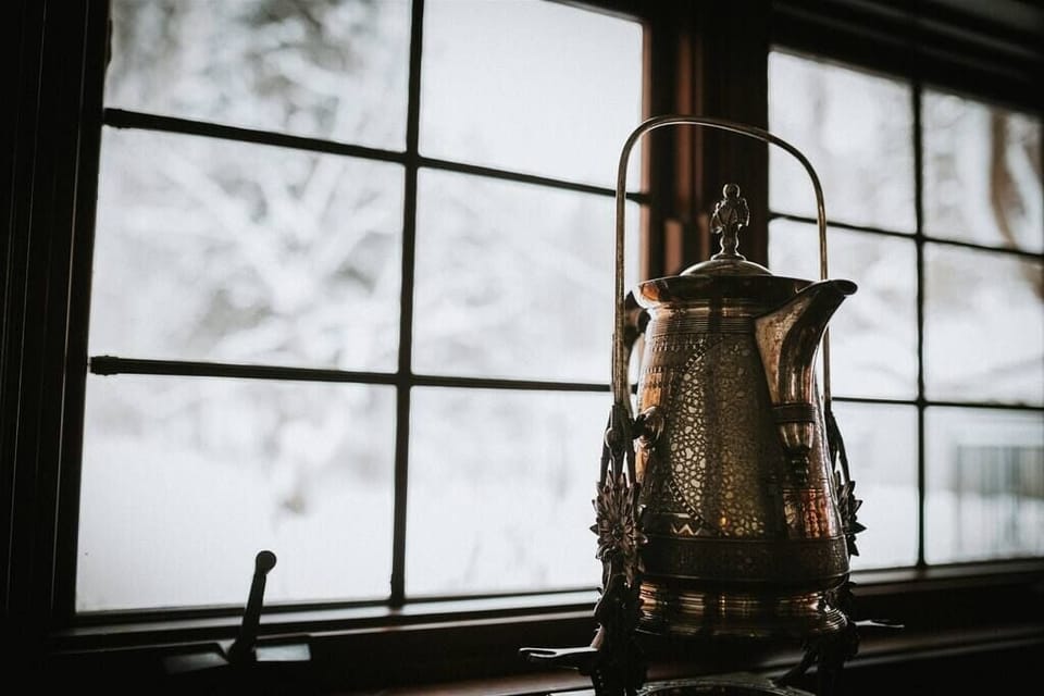 Cozy winter views through classic windows, complemented by timeless decor for a serene and warm atmosphere.