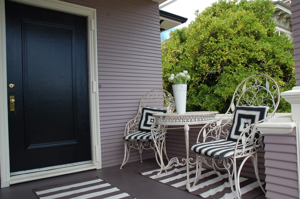  Front Upstairs Porch* Enjoy views of street & courtyard vines and orange tree.
