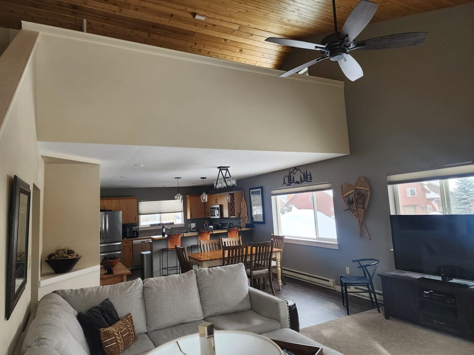 Kitchen, living, dining and open upstairs queen loft area
