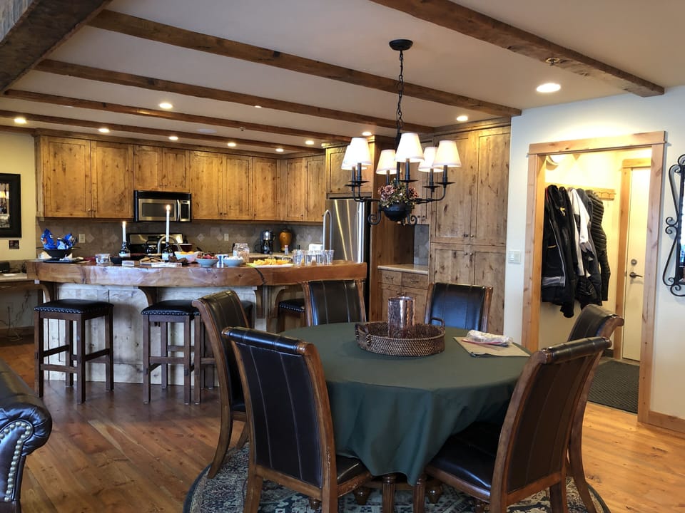 open kitchen, dining table and mud room area