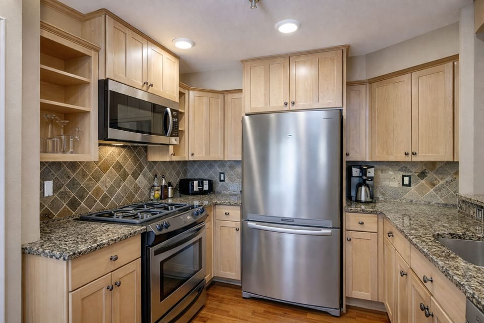 Your fully equipped kitchen features stainless steel appliances and granite countertops, perfect for preparing meals during your stay.