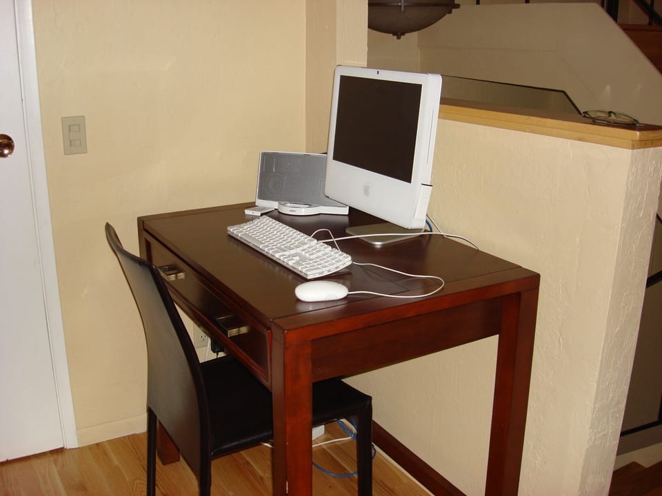 Desk with an iMac and internet service.  There's wi-fi, too. 
