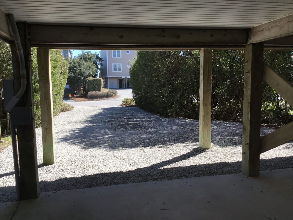 New gravel parking area.  Room for 8 cars under house and driveway.