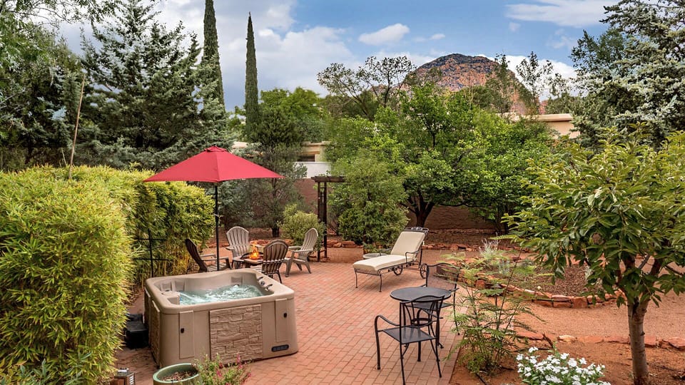 Private walled backyard with hot tub, and fire pit. 