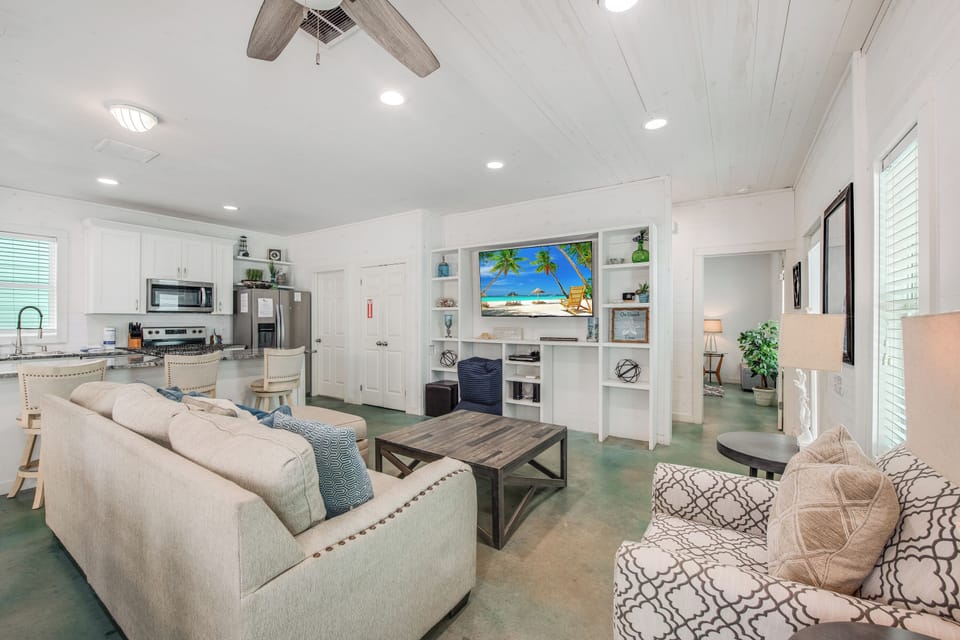 Relax in your bright, open living space with beach vibes and modern comforts—perfect for unwinding after a day of adventure.