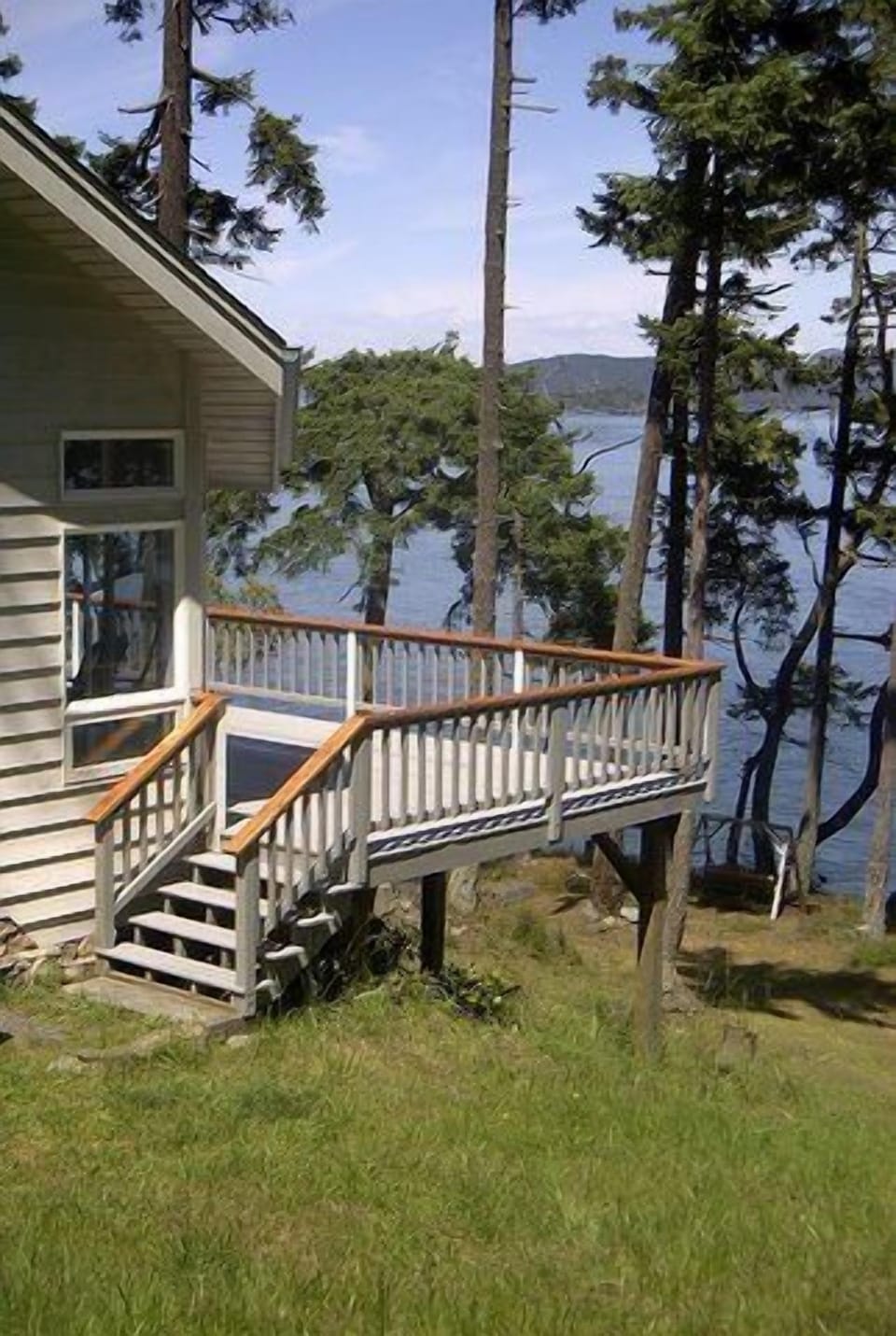 Deck w/ panoramic view of Strait of Juan de Fuca, Orcas, Lopez, Mt Baker & more.