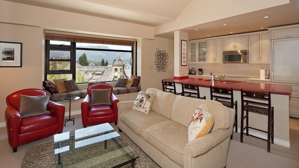 The elegant style and loads of natural light in this living area make it a desirable place to reminisce about the day.
