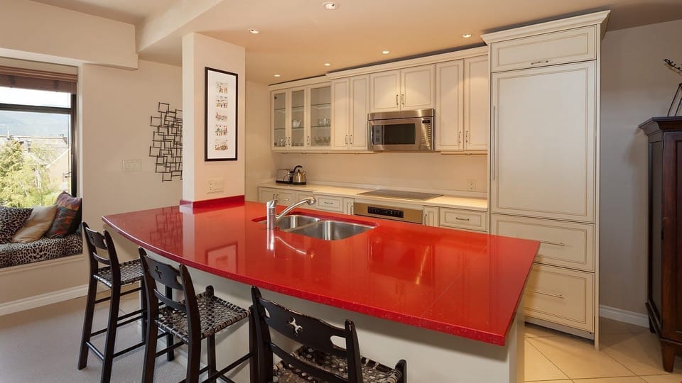 The gourmet kitchen is fully-equipped, spacious, and allows you to join everyone in the living room for laughs and conversation!