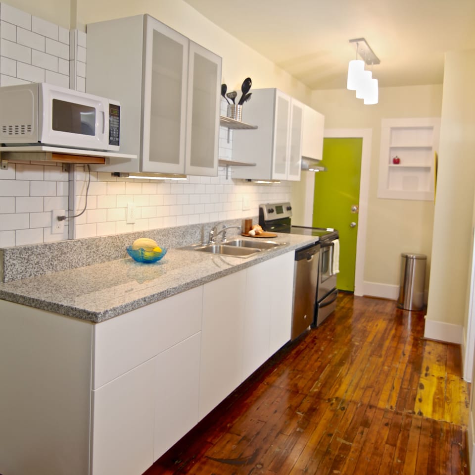 Galley kitchen with view to back door