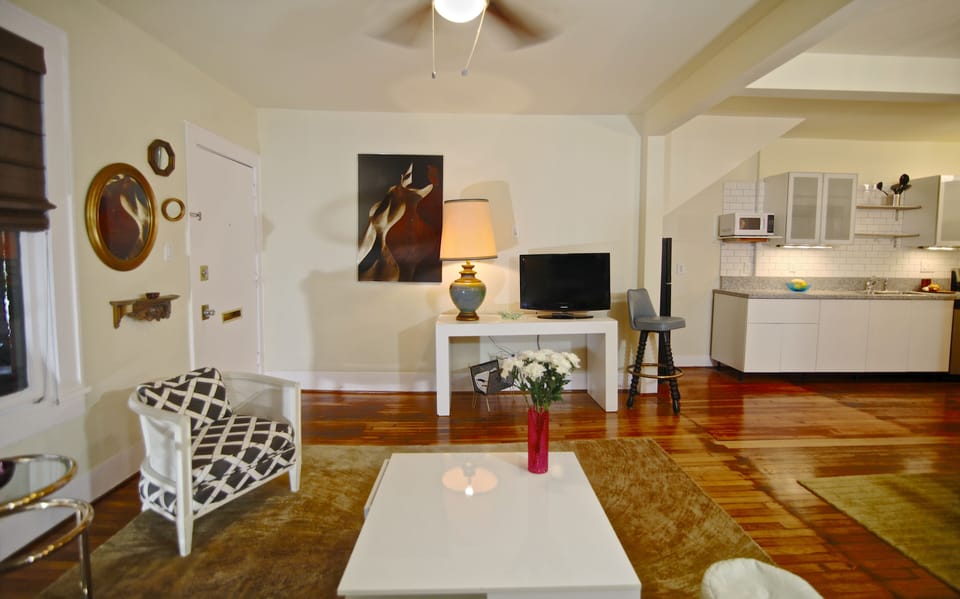 View of living and open galley kitchen