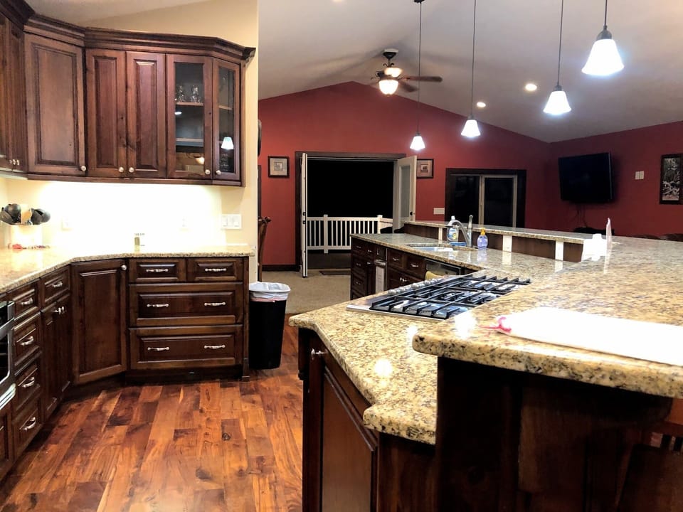 Large kitchen w/walk out deck. Seats 24 for eating + 8 sectional and 1/2 bath.