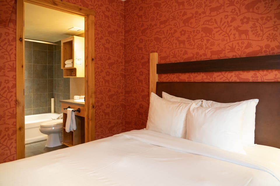 The beautiful bedroom features an ensuite bathroom.
