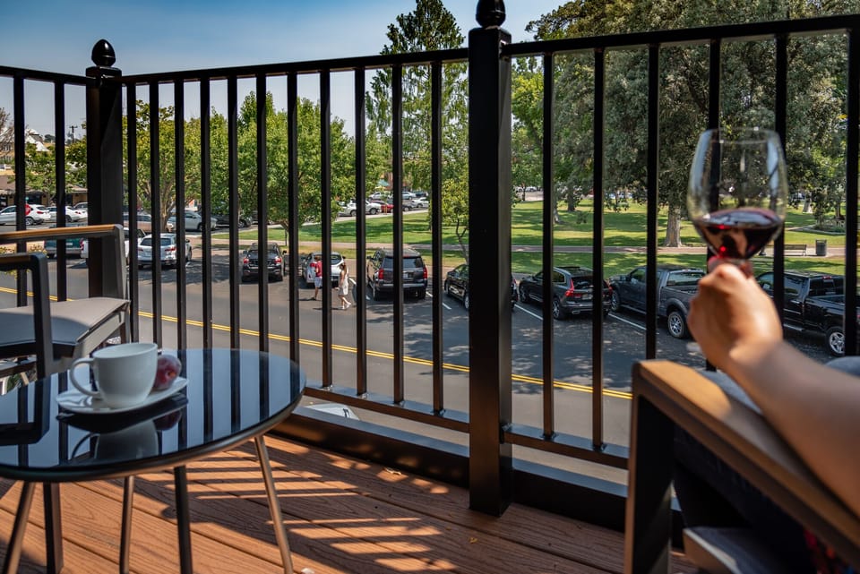 Unwind on the balcony with rail shadows and fresh air