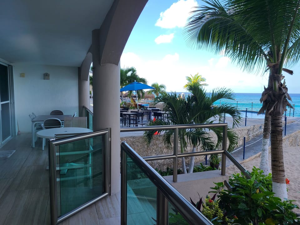 Left side of the terrace showing two tables and chairs. 