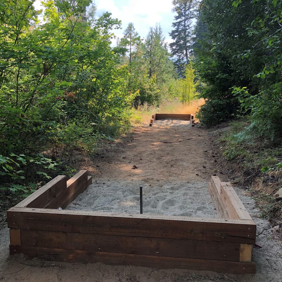 Horseshoe pit off the back patio