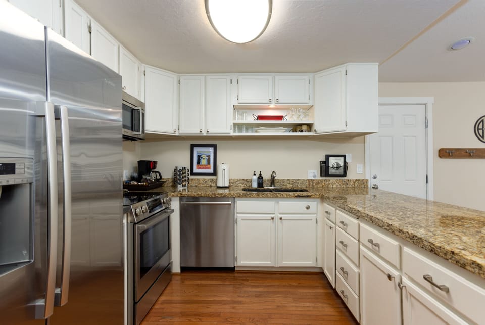 Kitchen has fridge, microwave, stove, oven and dishwasher