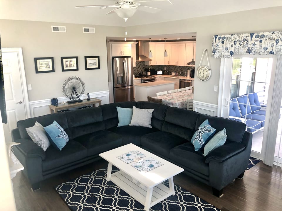 Family room sectional sofa, 2 chairs, table and 4 chairs, TV, fireplace