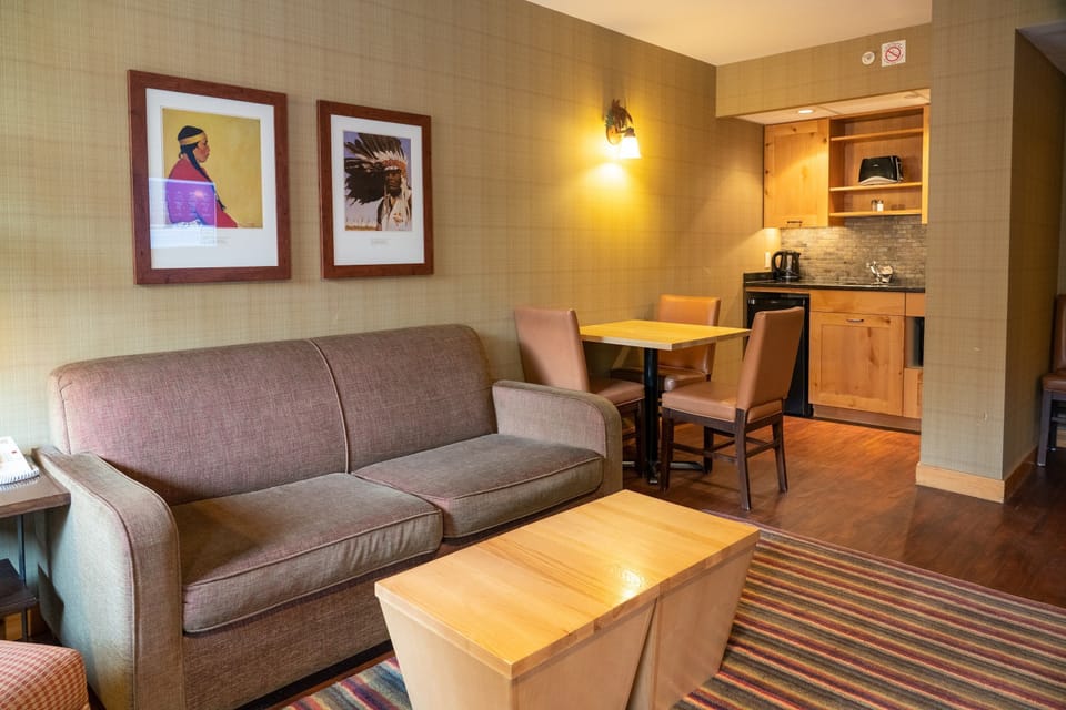 Sit back on the comfortable sofa in the beautiful living room featuring themed decor.