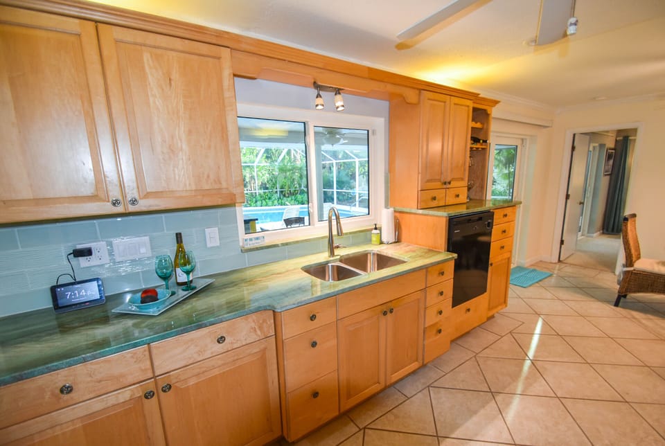 Serving window to the patio and the granite extends outside.