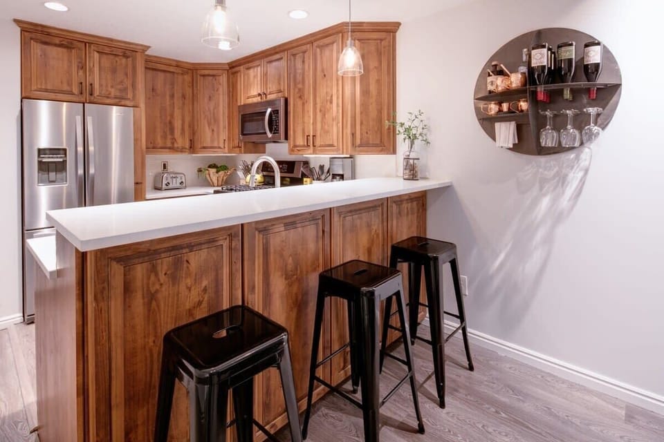 Kitchen: Sleek amenities and modern bar seating for delightful culinary adventures!