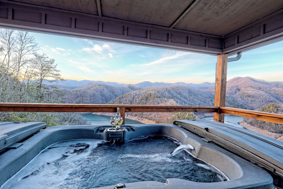 Private hot tub with sweeping mountain views on a covered deck