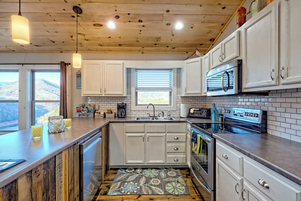 Bright fully equipped  kitchen with mountain views and spacious modern finishes