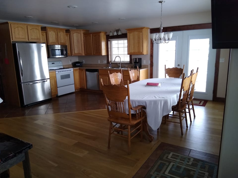 View of kitchen and dining room from open living room.
