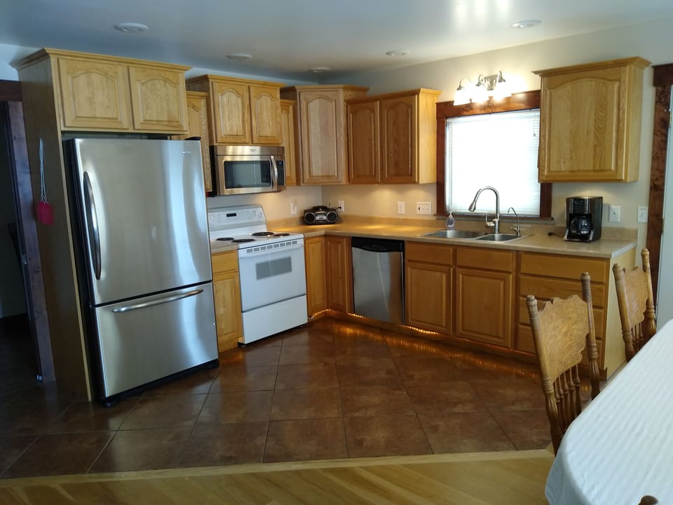 Open floor plan, fully-stocked kitchen.