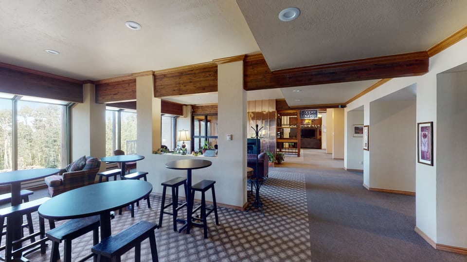 Work/Dinning area at Copper Lounge w/ Guest Kitchen, Sports TV, FREE Air Hockey