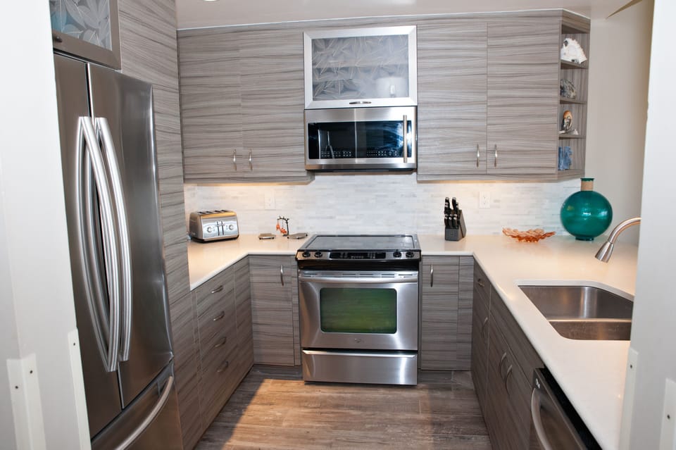 Bright, open gourmet kitchen with stainless steel appliances