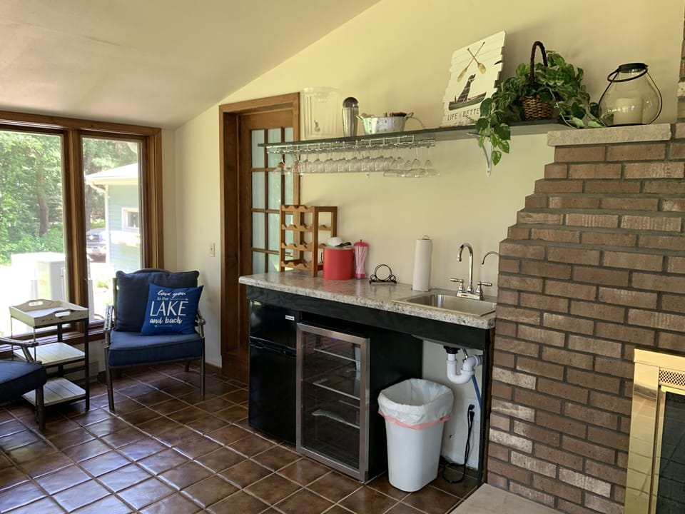 Outdoor bar area in our 3 seasons room with easy access to the lake