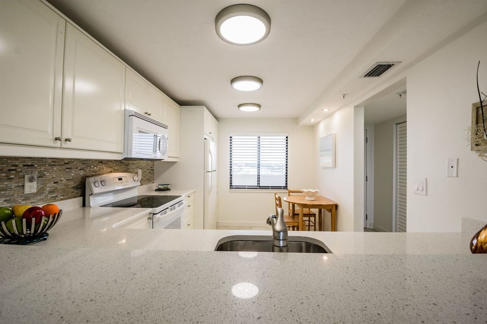 From your kitchen window you welcome  sunrises over the  intercoastal waters.