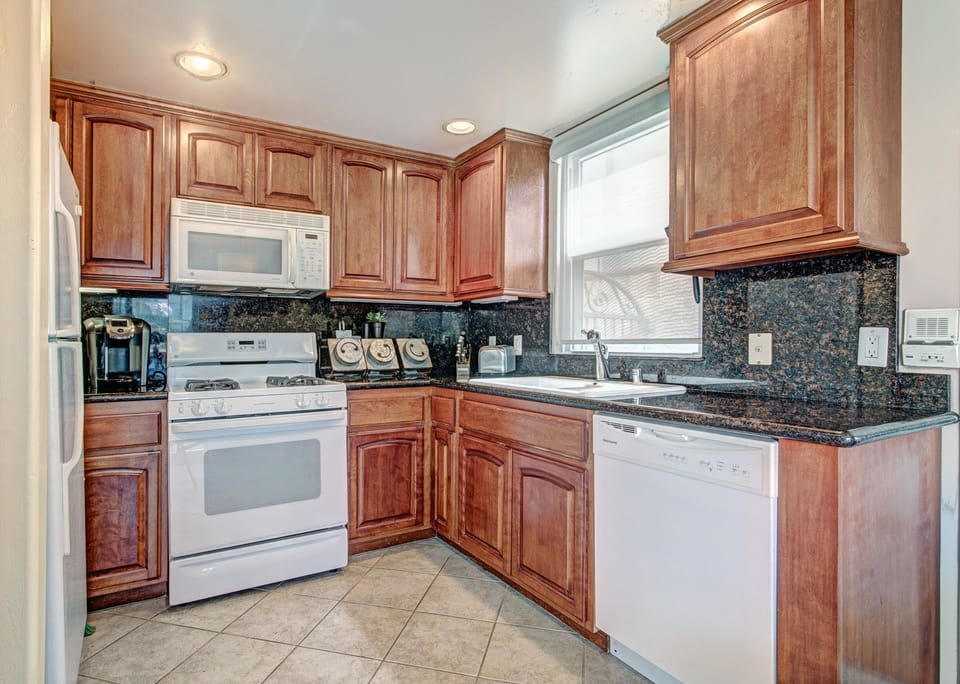Everything you need including: a microwave, a stove, a dishwasher, and a Espresso maker.
