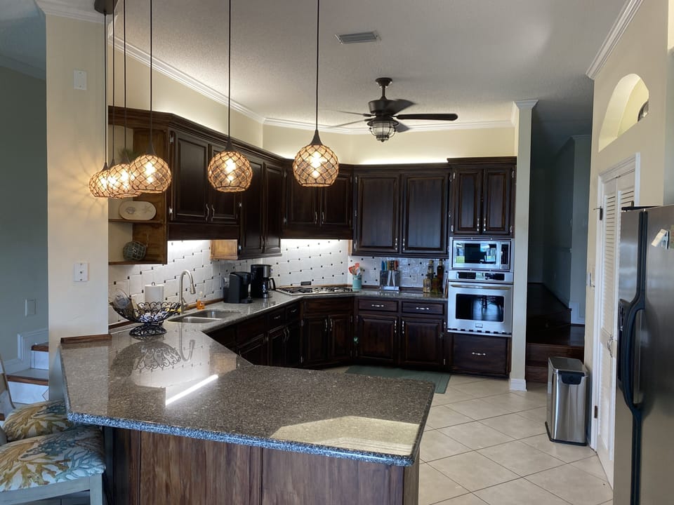 Large kitchen w/pantry. Fully stocked with appliances, dishes, etc.