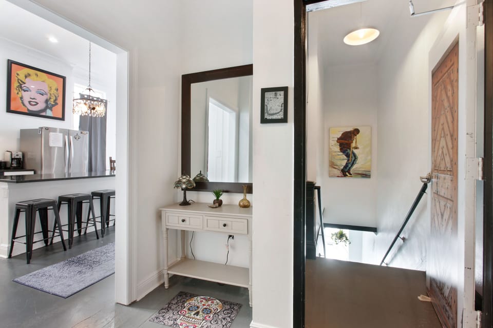 It’s the entire 2nd floor up 1 flight of stairs. Eclectic wall decor throughout 