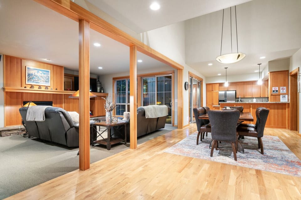 The open-concept design seamlessly connects the living, dining, and kitchen areas, creating a bright and spacious atmosphere perfect for entertaining or unwinding with loved ones.