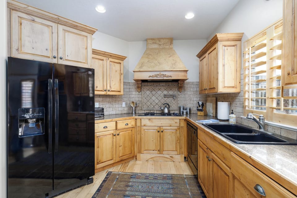 Kitchen - main level. Recently re-stocked with caste iron cookware, re-usable to-go containers, a large crock pot and more.